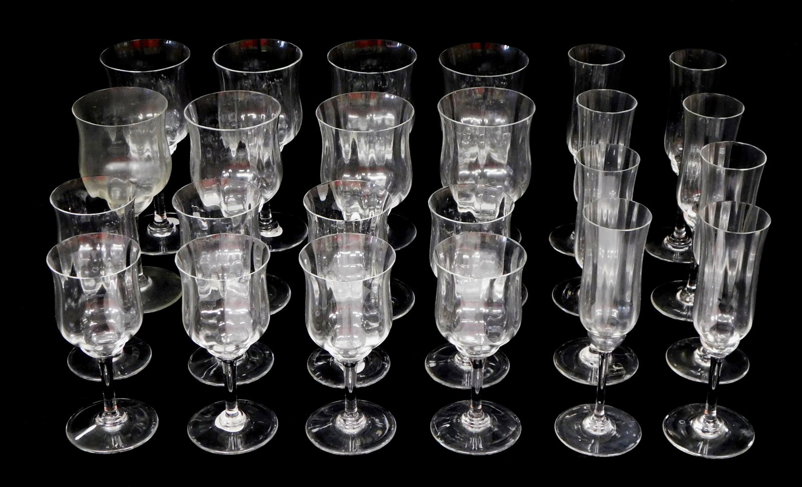GLASS: Baccarat crystal stemware, "Capri (aka Optic)" pattern, twenty-four pieces, acid etch maker's: GLASS: Baccarat crystal stemware, "Capri (aka Optic)" pattern, twenty-four pieces, acid etch maker's mark on base, bowls with wavy sides and slightly tapered waist, pieces include: eight champagne flu