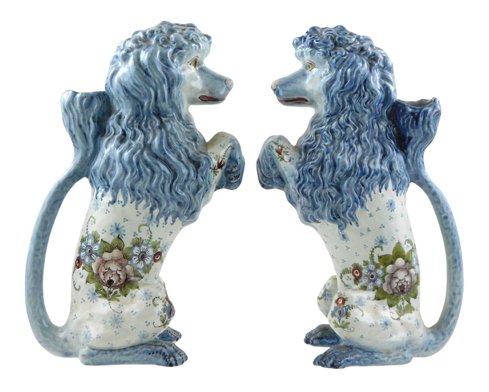 Pair of St. Clement majolica ‘Poodle’ pitchers, France, c.1890, each modelled as a begging
