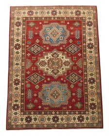 RUG: Uzbek Kazak, 4' 8" x 6' 6", wool on cotton, navy, light blue, gold and salmon geometric on