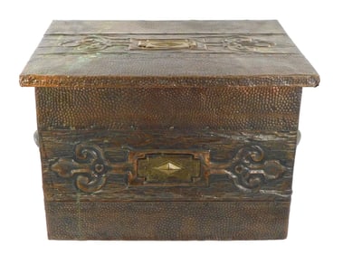 Wooden coal chest with tooled brass overlay panels, featuring raised snakeskin like texture, mounted