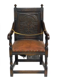 Armchair, in the manner of English 17th C, oak, carved flat panel back with floral and berry motif,