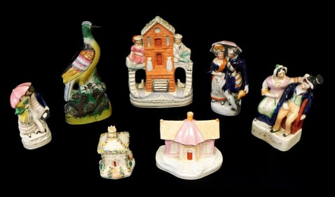 Staffordshire, English, 19th C., seven pieces featuring figures, dove and houses, scattered damages