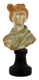 Terracotta fragment, bust of a woman/goddess, elaborately coiled hair, depicted wrapped in green