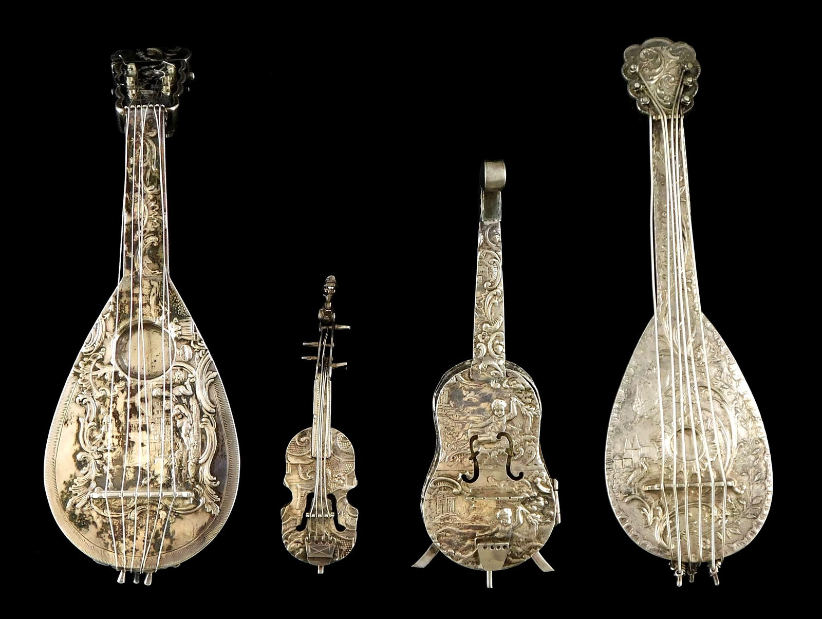 SILVER: Four continental silver string instrument models, one marked “800?? and three tested (1 of 8)