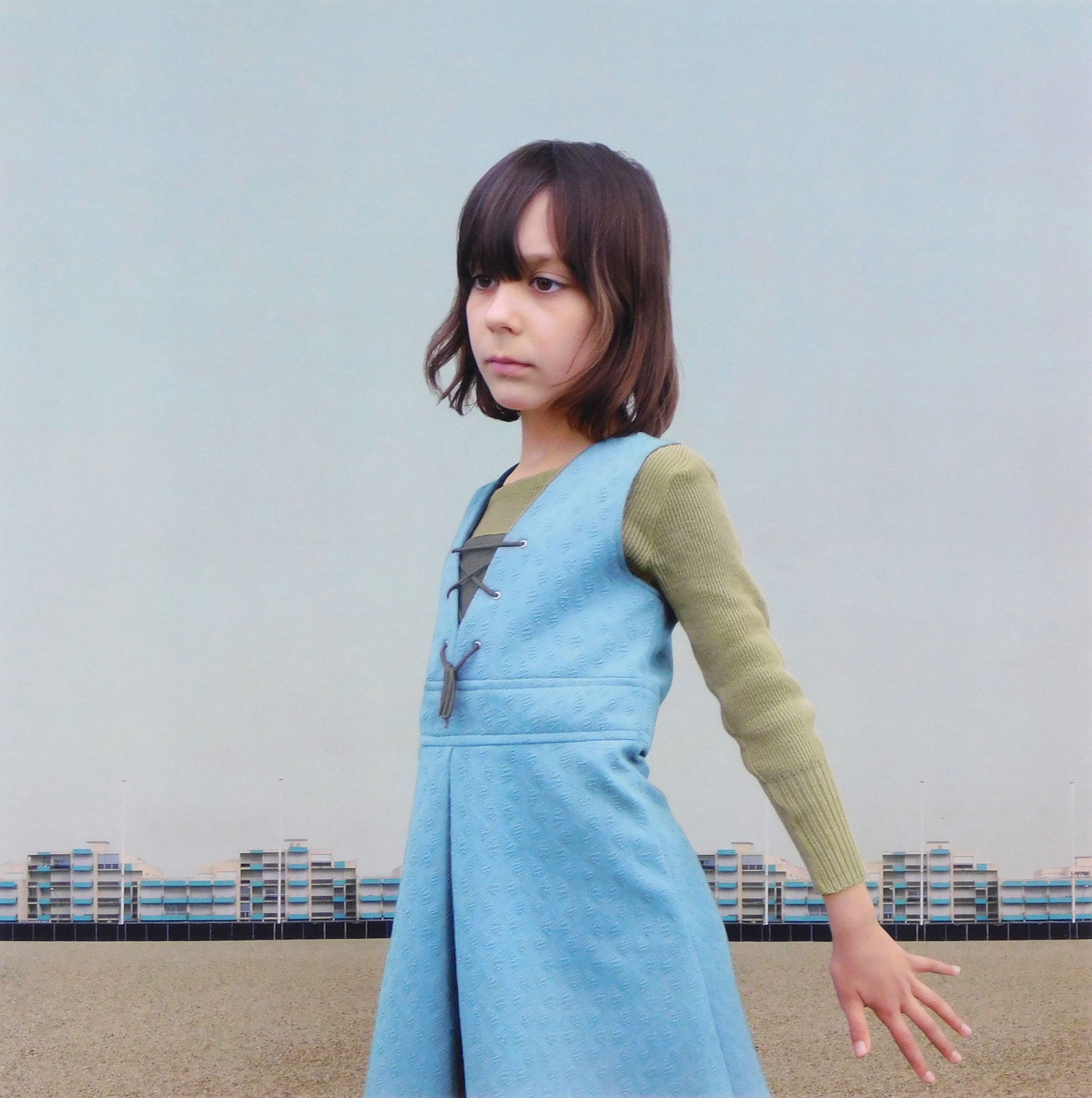 +Loretta Lux (German, b. 1969), "The Blue Dress", 2001, llfochrome (aka lifochrome) print on: +Loretta Lux (German, b. 1969), "The Blue Dress", 2001, llfochrome (aka lifochrome) print on aluminum, edition 4/7,depicts young brunette girl in three quarter profile with Mid-Century architecture an
