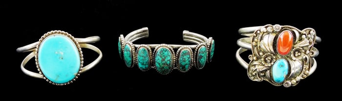 JEWELRY: Three southwest style bracelets, one with a central turquoise stone; one with turquoise and
