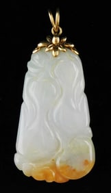 ASIAN: 14K and carved hardstone pendant resembling lavender jade, 20th C., stamped "Barton" and "14"