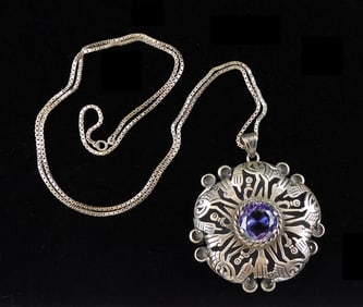 JEWELRY: Los Ballesteros silver pendant necklace with faceted purple stone at center, Igula & Taxco,