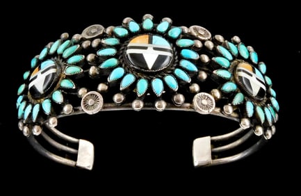JEWELRY: Zuni silver cuff bracelet with three medallions at center featuring inlaid turquoise,