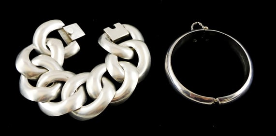 JEWELRY: Mexican sterling silver, two pieces, one hollow bangle and one large flat link bracelet,