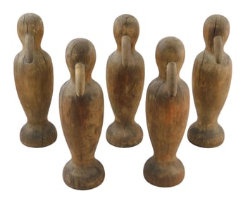 Penguin Skittles lawn bowling set, 20th C., similar to John C. Kohaut, five pins comprised of carved