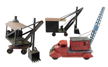 TOYS: Three early 20th C. pressed-steel trucks, Buddy L and Marx, etc., one crane and two with
