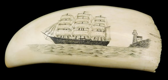 SCRIMSHAW: Engraved whale tooth, engraved decoration of three masted ship and lighthouse on obverse,
