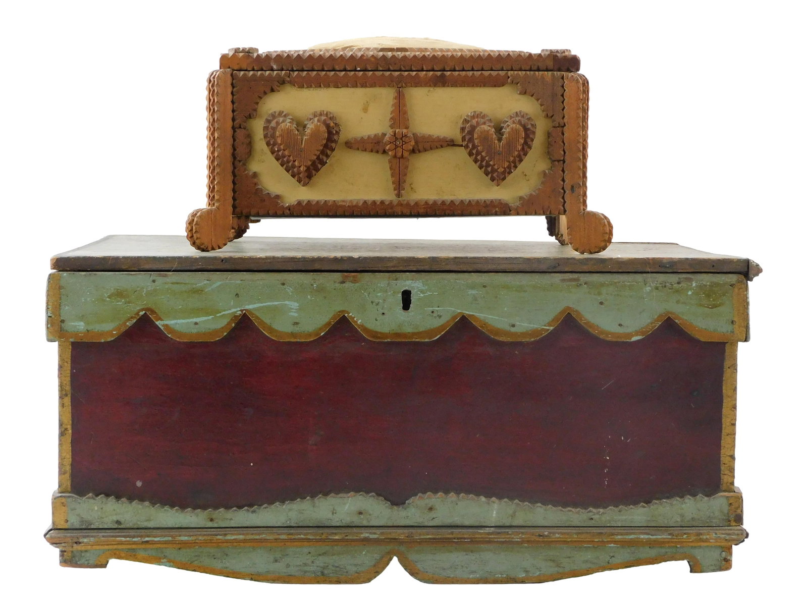 Two folk art wooden boxes, includes: first, 20th C. tramp art hinged-lid sewing cushion box,: Two folk art wooden boxes, includes: first, 20th C. tramp art hinged-lid sewing cushion box, features chip edge border and ornamental heart and star additions, lid of box has sewing pin cushion with c