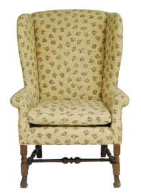 Queen Anne style wing chair, arched back with curved tapered wings, rolled arms with tan and