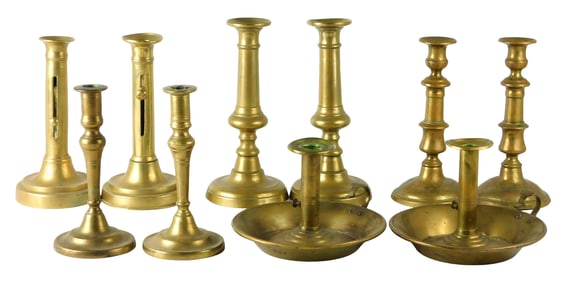 Ten brass candlesticks, English style 18th/19th C., five pairs, includes: two pairs of ejector brass