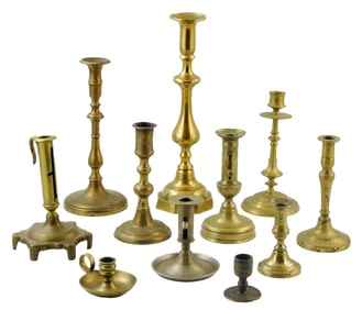Eleven brass candlesticks, some tonal differences between metal finishes, details include: ejector