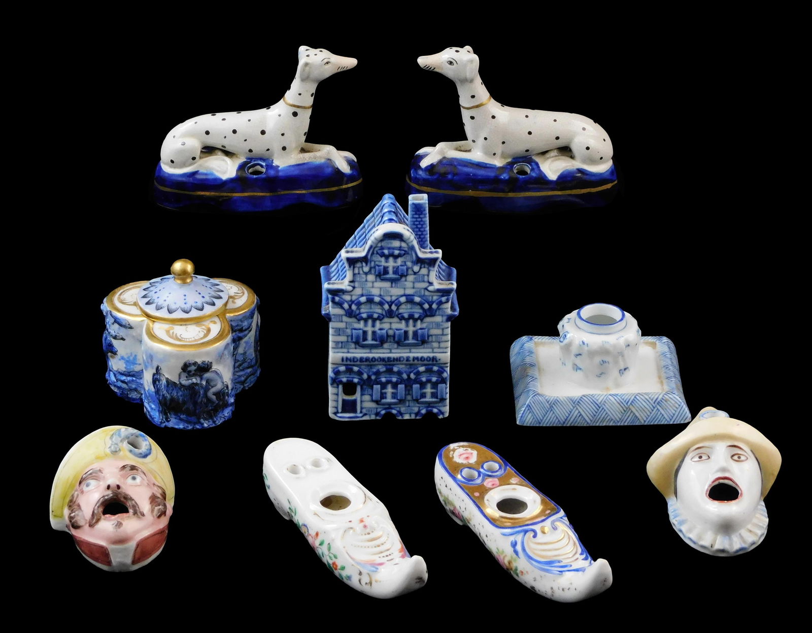 Capodimonte, Delft, Staffordshire, etc., nine pieces, mostly 19th C., details include: Pair of: Capodimonte, Delft, Staffordshire, etc., nine pieces, mostly 19th C., details include: Pair of Staffordshire reclining whippet inkwells on oblong base; pair of Staffordshire figural inkwell of faces,