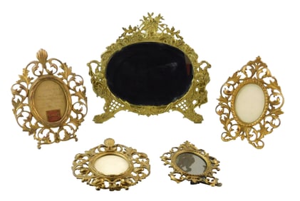 Five Florentine-style easel tabletop frames, all with pierced scrolling folate designs, largest