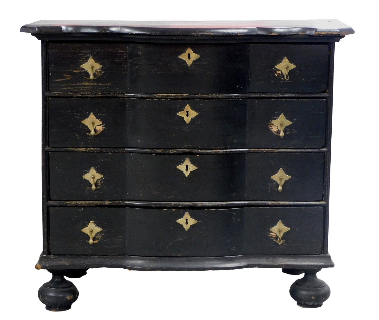 Four drawer chest, Continental, 18th C., pine, black painted finish, shaped and swelled top over: Four drawer chest, Continental, 18th C., pine, black painted finish, shaped and swelled top over conforming four swelled graduated drawers, teardrop pulls over base molding, raised on bun feet, wear c