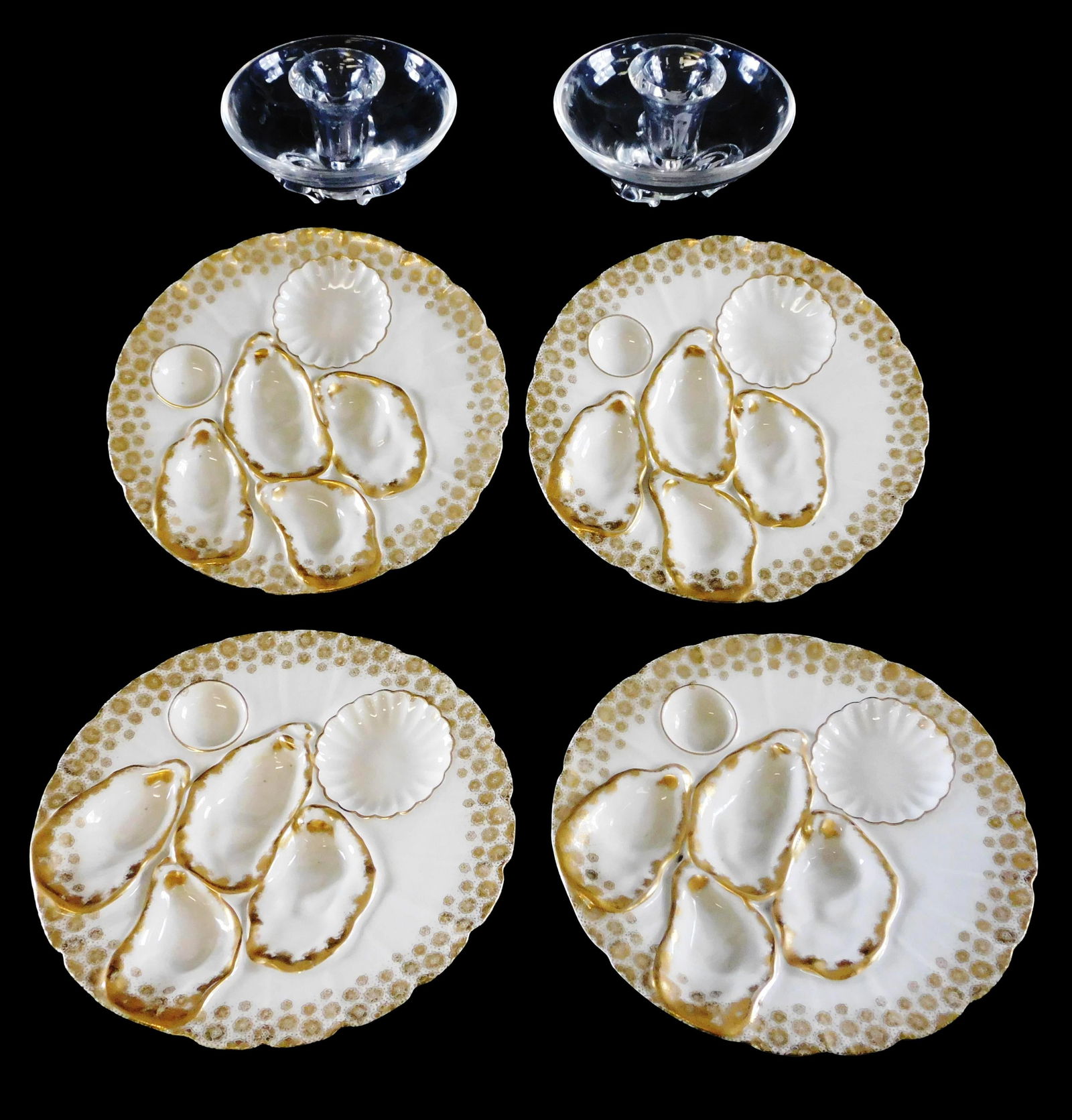 Steuben and Limoges serving ware, including: four Haviland Limoges oyster plates, late 19th C., four: Steuben and Limoges serving ware, including: four Haviland Limoges oyster plates, late 19th C., four wells for oysters and two sauce wells, white porcelain with delicate gold embellishment, 8 3/8" dia