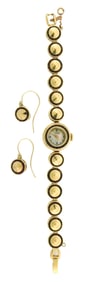 JEWELRY: 14K Ladies watch and matching earrings by Lucien Picard, set with garnets, details include: