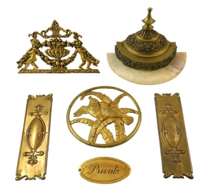 Six gilt metal architectural elements, early/mid 20th C., details include: circular plaque featuring