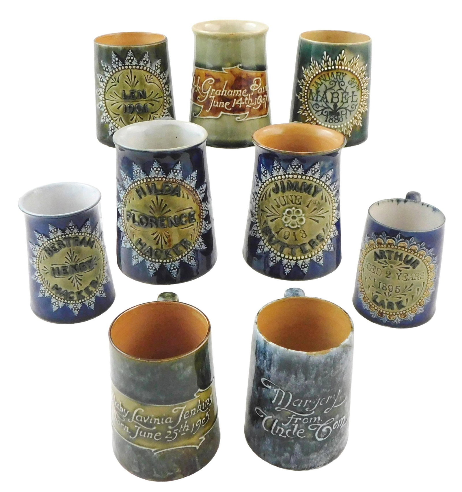ART POTTERY: Doulton Lambeth Commemorative hollowware, nine pieces, English, late 19th/ early 20th: ART POTTERY: Doulton Lambeth Commemorative hollowware, nine pieces, English, late 19th/ early 20th C., ceramic with blue and green glaze, all mug form and with dedication at front, dates range from 18