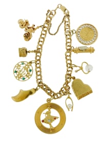 JEWELRY: 14K Charm bracelet with ten charms, filed flat, double curb link bracelet with lobster claw