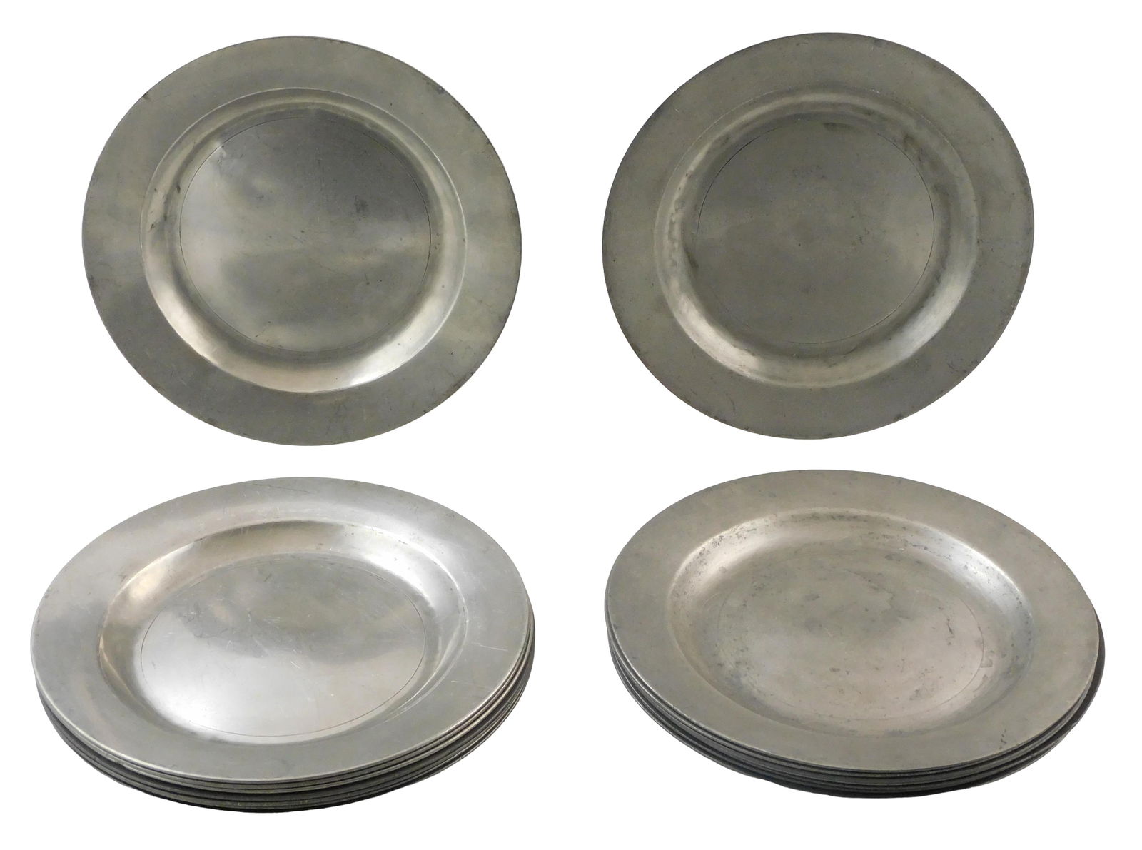 Sixteen English 18th C. pewter plates, includes four plates with stamped unidentified family crest: Sixteen English 18th C. pewter plates, includes four plates with stamped unidentified family crest (heraldry) and London label on bottom; remaining twelve plates all stamped with London label, maker's