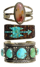 JEWELRY: Three Native American southwest cuffs, tested silver, including a large central oval agate