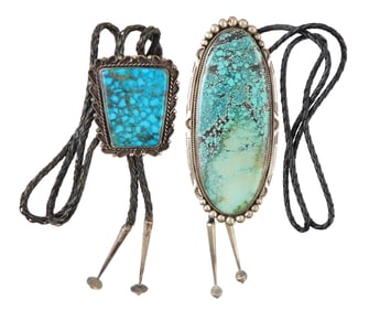 JEWELRY: Two Navajo silver and turquoise bolo ties, the first by Eugene Belone, large oval stone set