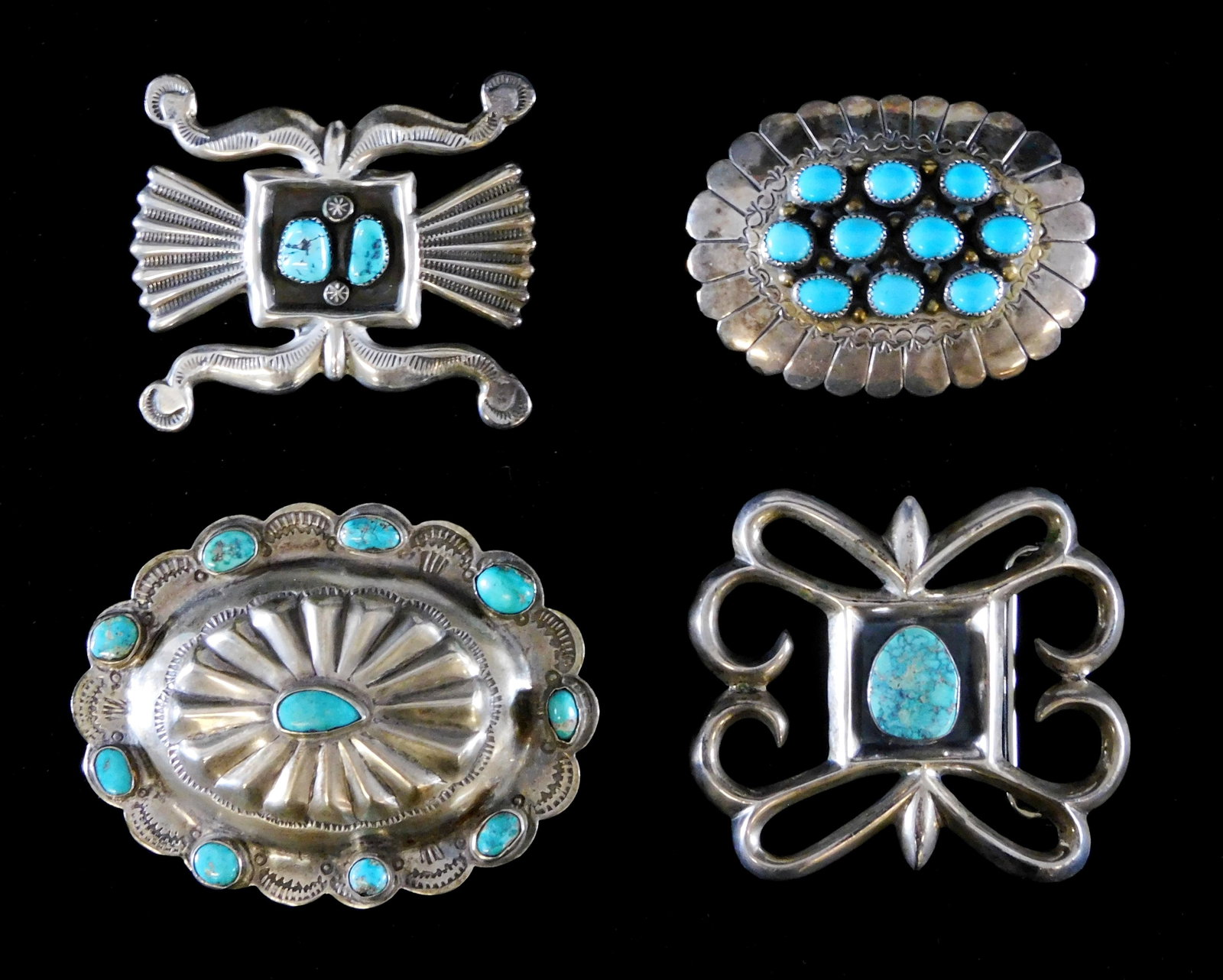 SILVER: Four Southwest style silver belt buckles, all with turquoise accents, two medallion shape,: SILVER: Four Southwest style silver belt buckles, all with turquoise accents, two medallion shape, two with scrolling design, and one retrofitted into a pin/pendant, one medallion with "sterling" stam