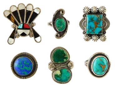 JEWELRY: Six Southwest style rings, tested silver, including one Zuni inlay with Sun face; some