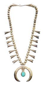 JEWELRY: Squash blossom necklace, fourteen silver blossom drops on single strand of silver beads,