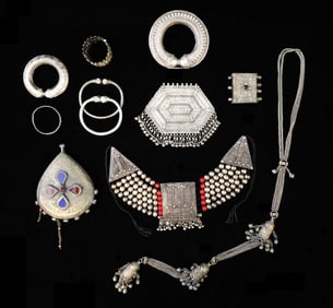 TRIBAL: Eleven pieces of Bedouin, Yemeni, and African amulets and jewelry, silver, silver alloy, and
