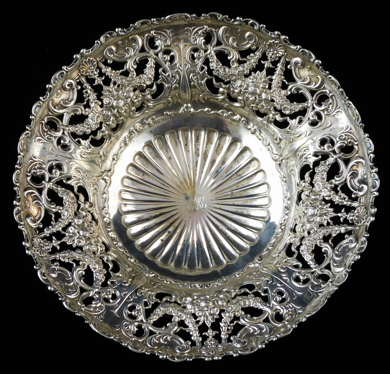 STERLING: Whiting Manufacturing Co. pierced repousse footed bowl, late 19th C., wide rim with: STERLING: Whiting Manufacturing Co. pierced repousse footed bowl, late 19th C., wide rim with pierced design of floral swags and ornate decoration, bowl interior with concentric scalloping and small e
