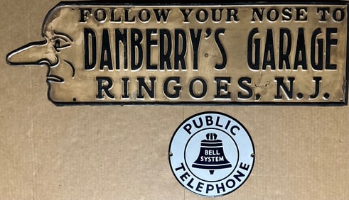 Two signs - Danberry’s Garage, die formed tin, 27 x 8, gd cond and seven inch dia porcelain