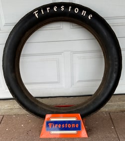 Brass era period Firestone Non Skid tire display, with display stand, tire size is 36 x 4.5, overall