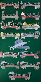 Collection of plate toppers mounted on a large board, green back ground, 27 x 48, vg condition