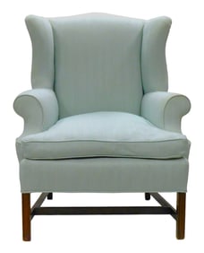 Wing chair with celadon upholstery, 20th C., hardwood frame with straight molded leg, scroll sides,