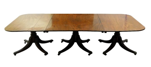 Georgian style triple pedestal banquet table, c. 1900, oblong top with three ring turned standards