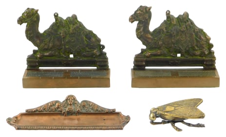 Four metal desk accessories, 19th/20th C., including: pair of camel bookends, heavy cast iron with