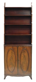 George III style bookcase on cabinet, 19th C., stepped open shelves above base cabinet featuring
