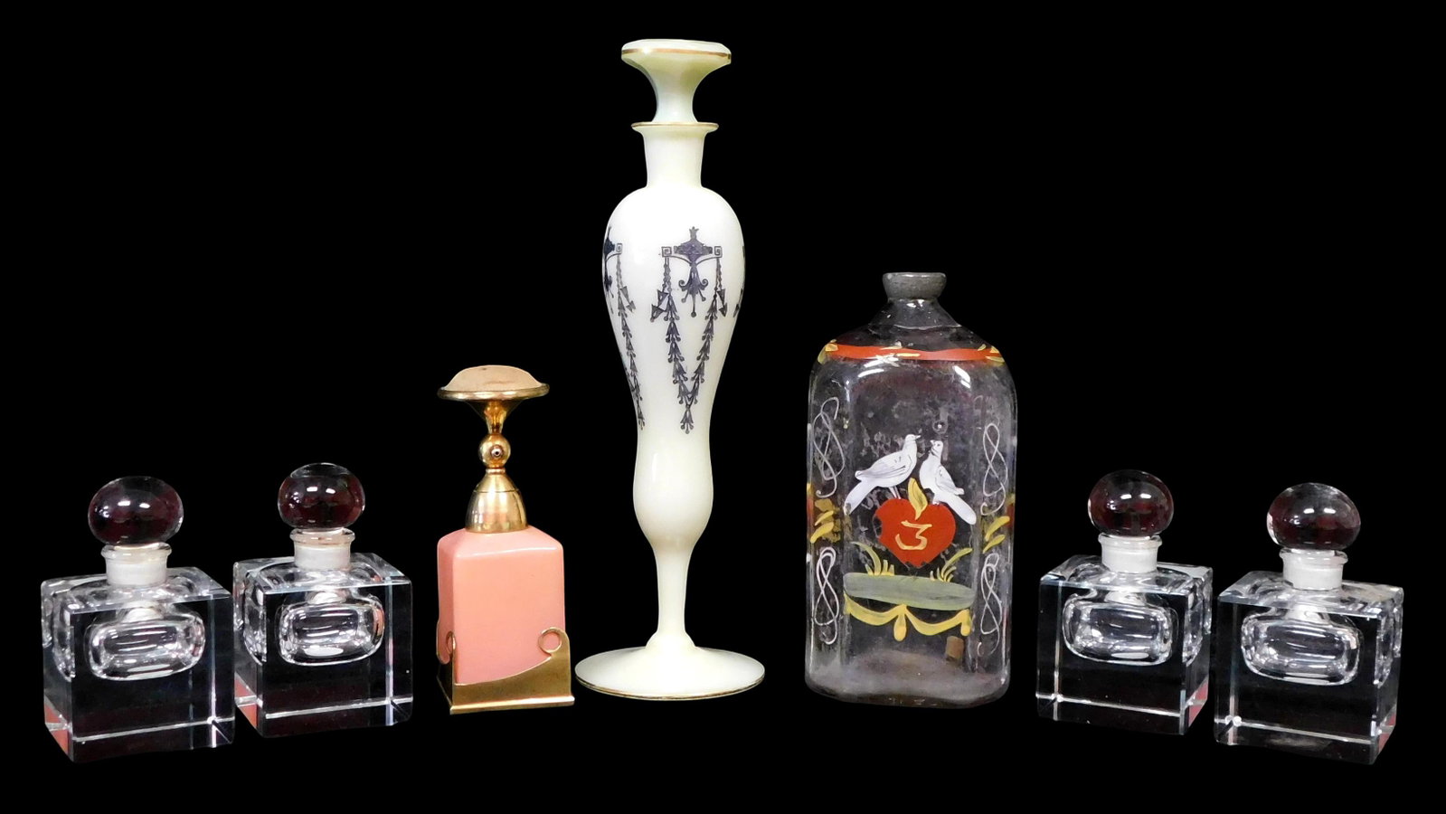 Seven cologne bottles, includes set of four Ralph Lauren crystal bottles, modelled after Regency: Seven cologne bottles, includes set of four Ralph Lauren crystal bottles, modelled after Regency inkwell, unmarked, 3" h. x 1 3/4" w. x 8" h.; footed white glass bottle with stopper and painted design