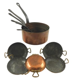 Eleven French copper pans, copper pans with brass or cast iron handles, details include: five small