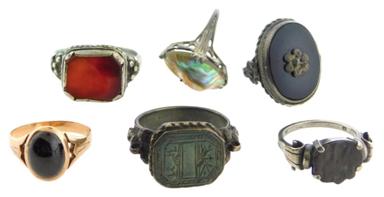 JEWELRY: Six European style rings including a tested 10k garnet ring (2.9 grams) ; three tested