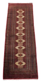 RUG: Modern Bokhara runner, 8' 10" l. x 3' 2" w., red ground, pattern includes nine tan medallions