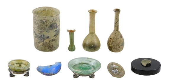 + Iridescent glass vessels and fragments, nine pieces, details include: three Roman tear vases,