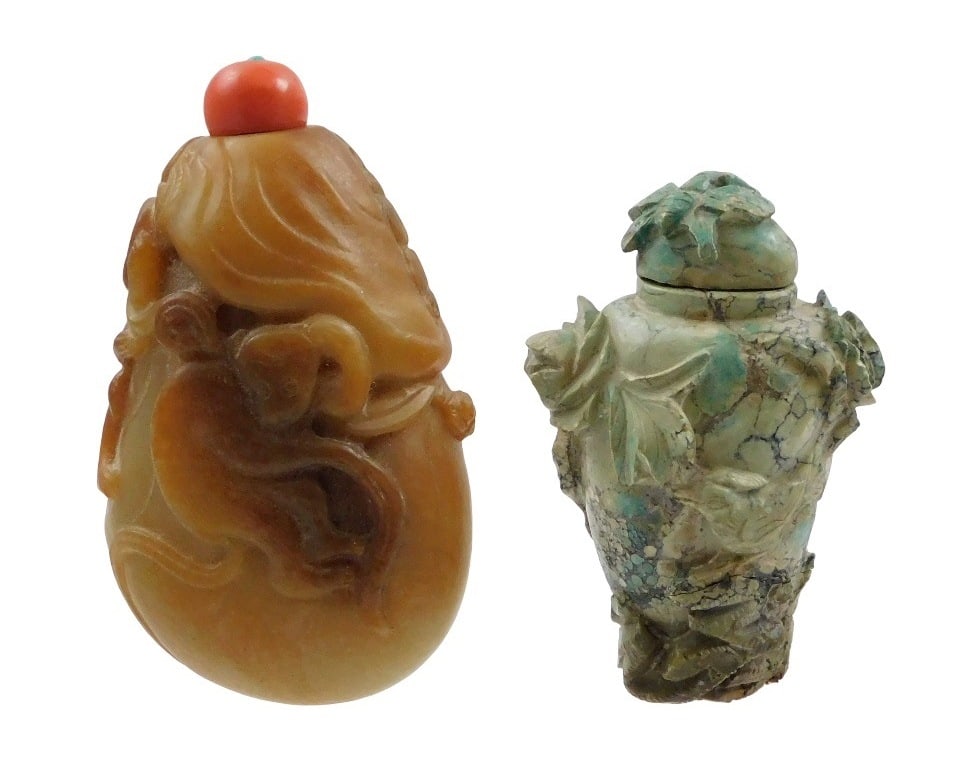 ASIAN: Two carved hardstone snuff bottles: one possibly russet jade with carvings of monkeys and (1 of 2)